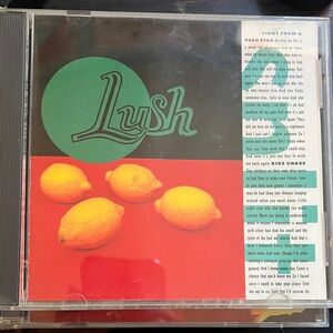 Lush CD with Green and Red Lemon Design